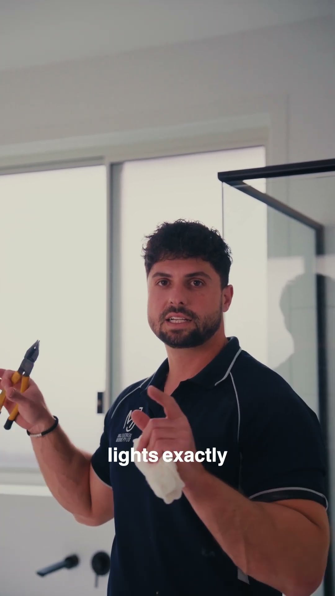 Electrician discussing lighting design and placement for a new home