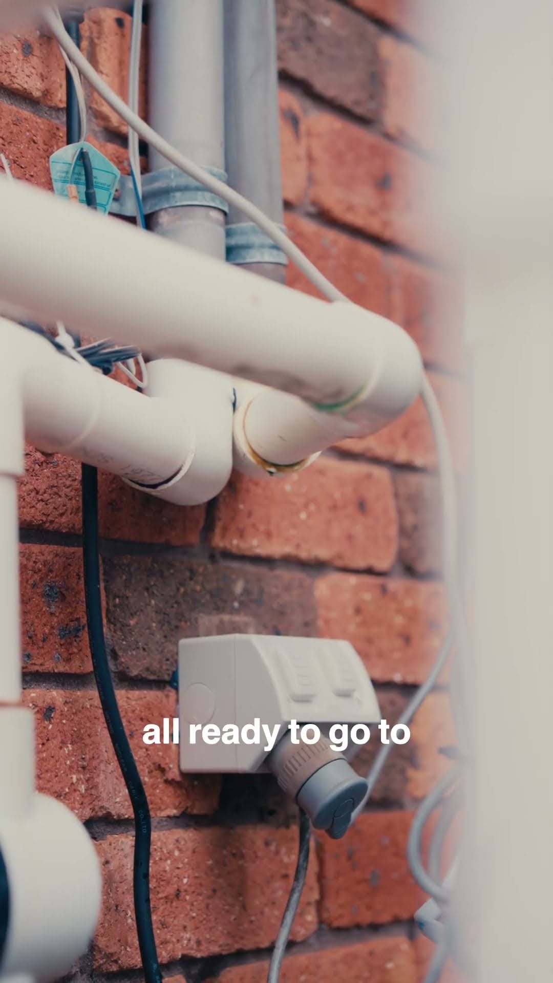 Electrician sealing an outdoor power point against water ingress