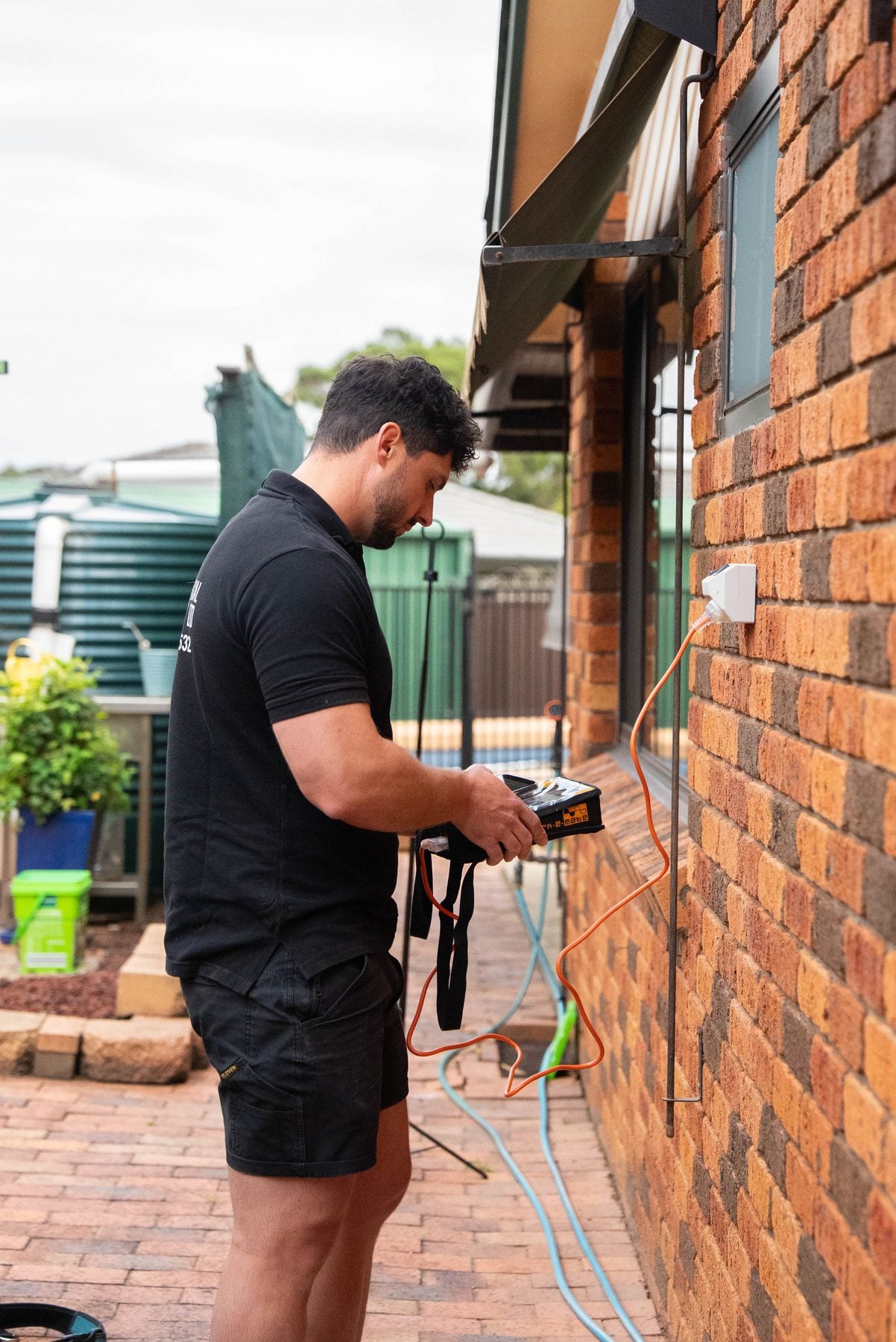 Testing a newly installed weatherproof outdoor power point at a Bossley Park home